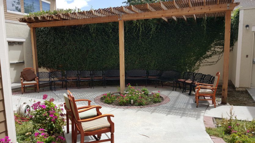 A patio with chairs and tables in it