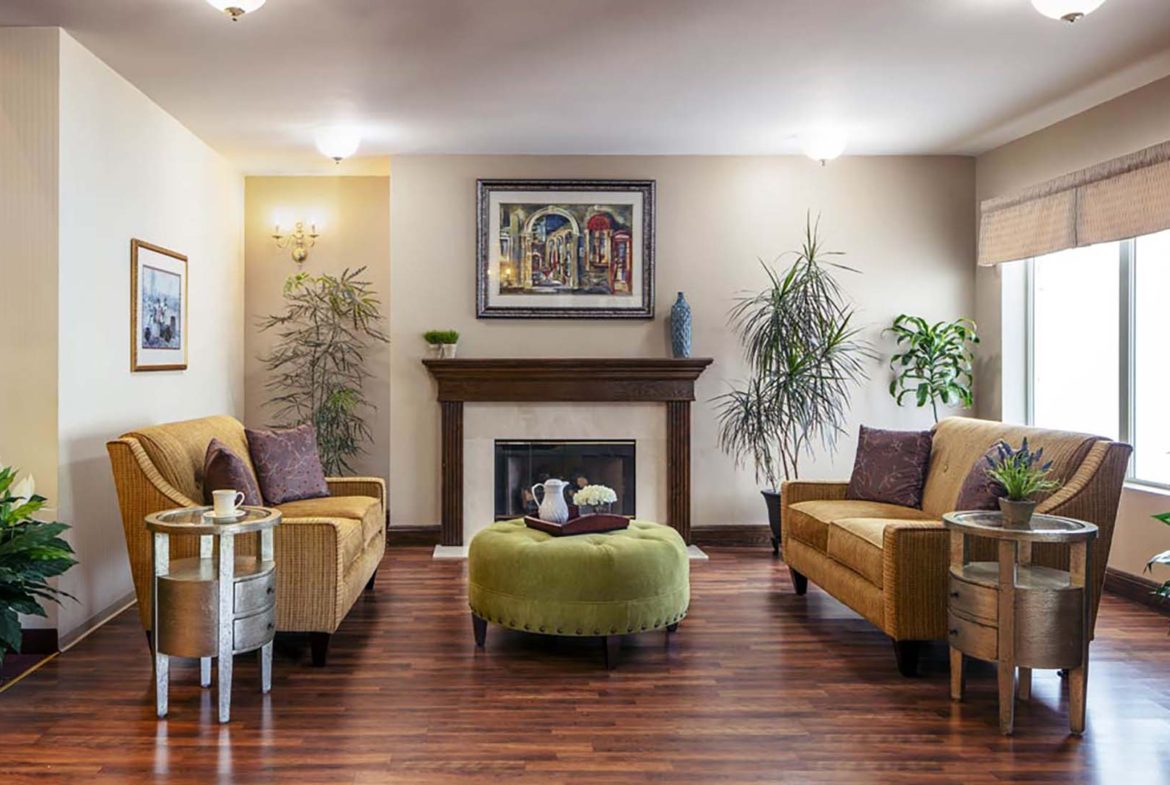 A living room with wood floors and furniture.