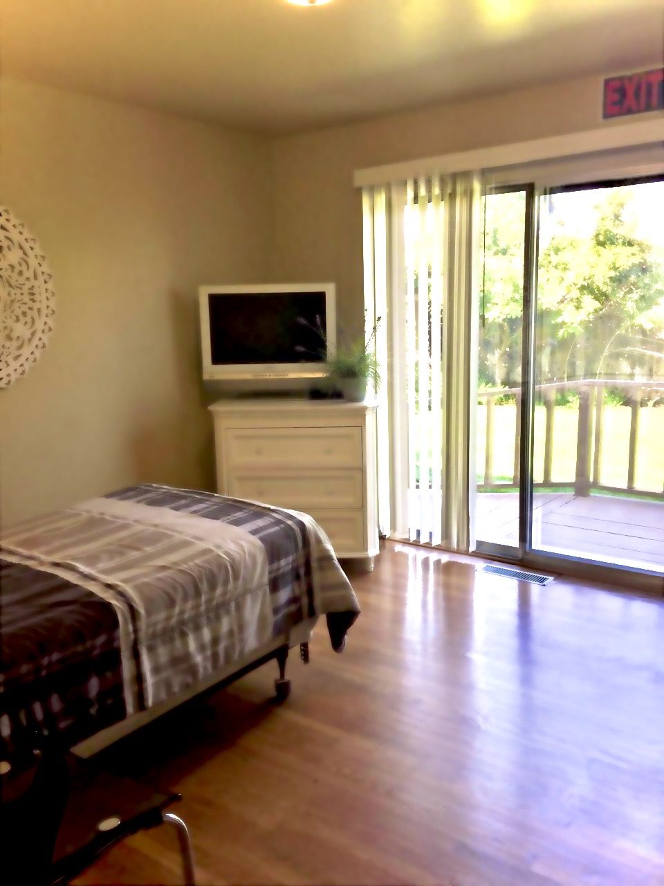 A bedroom with a bed and television in it