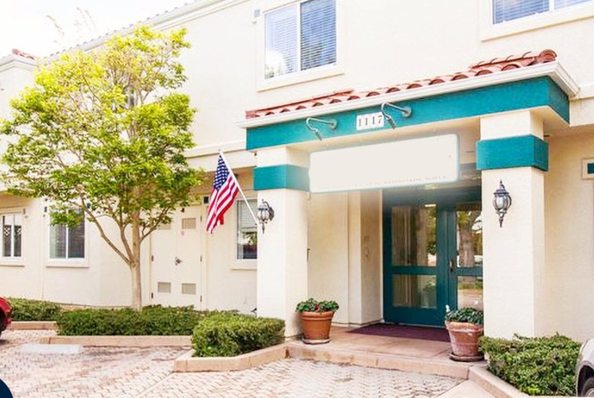 A building with an american flag on the front.