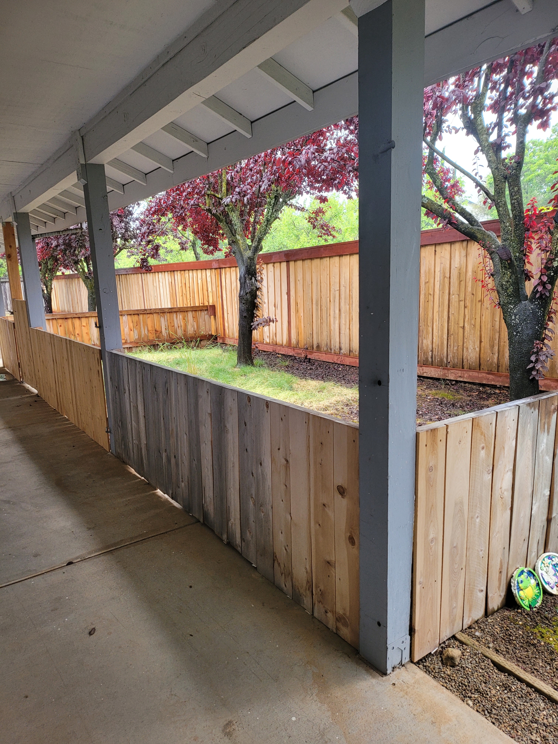 A wooden fence with trees in the background