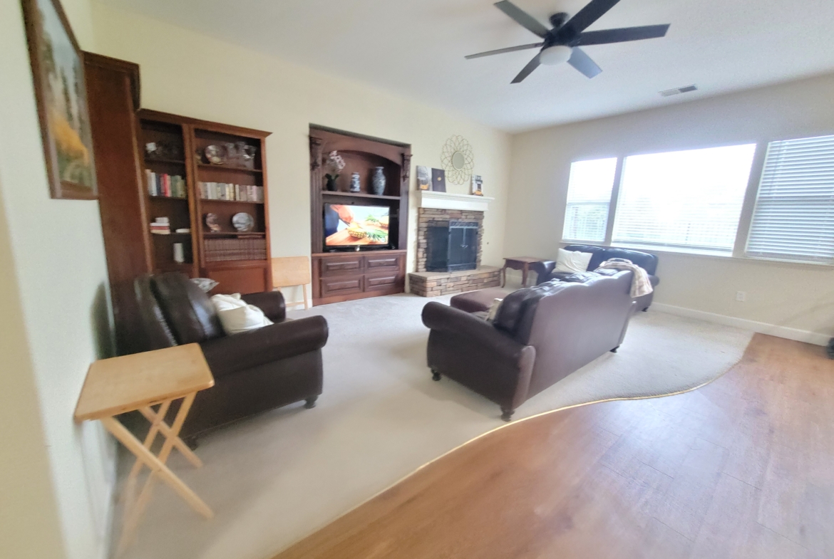 A living room with two couches and a television.