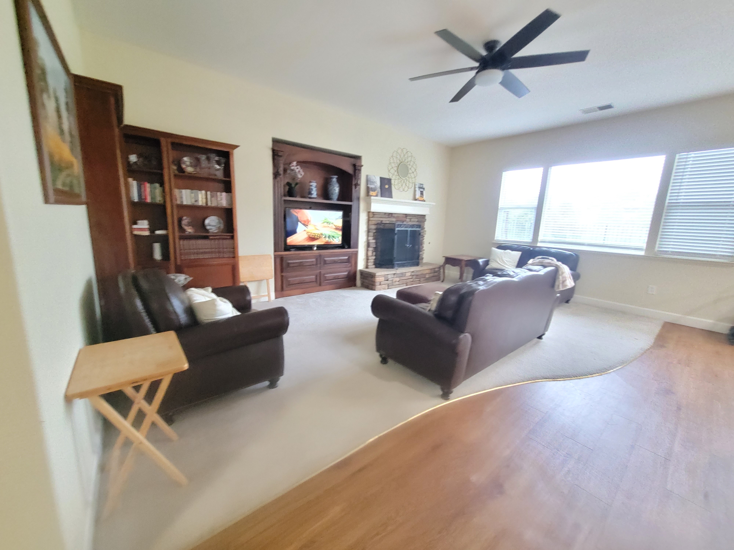 A living room with two couches and a television.