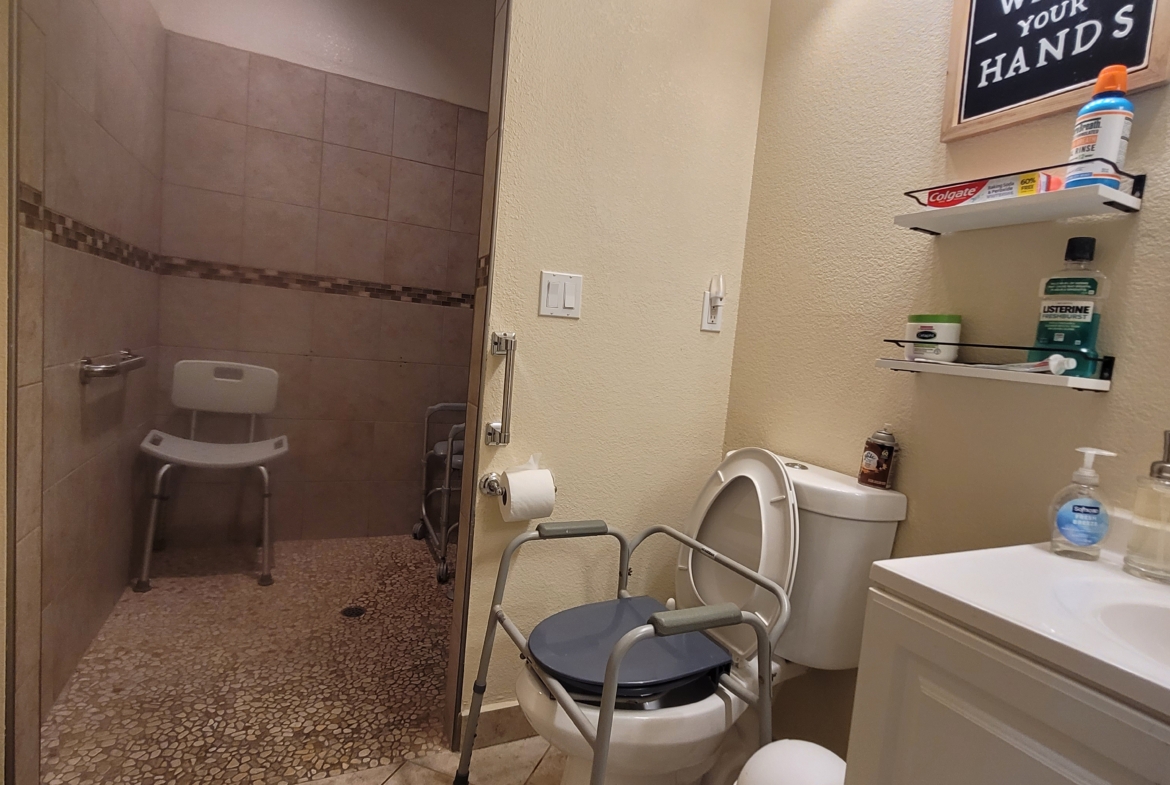 A bathroom with a toilet and sink in it