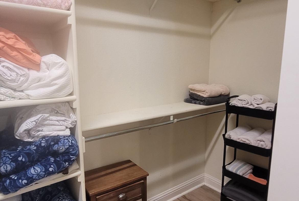 A closet with shelves and drawers in it