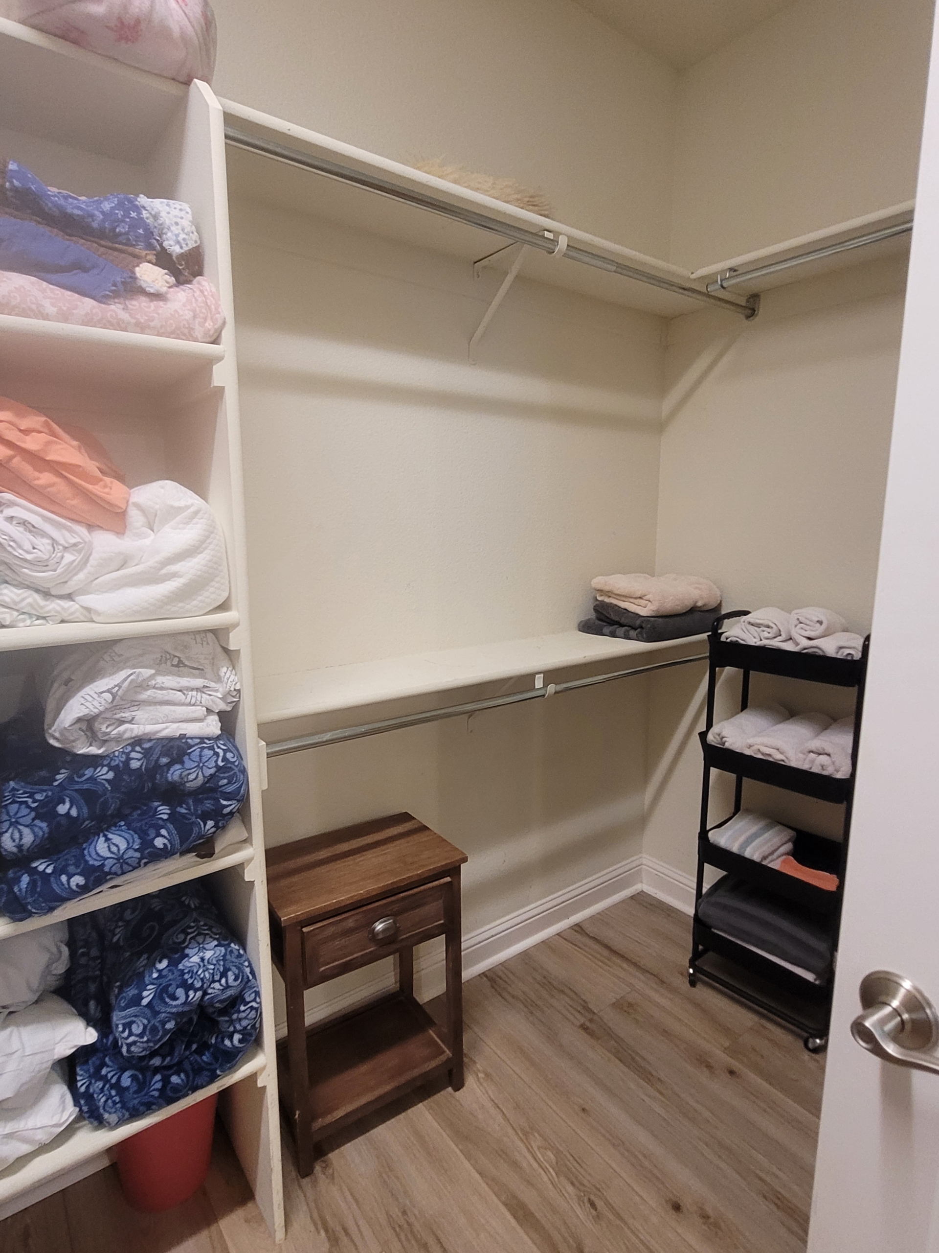 A closet with shelves and drawers in it