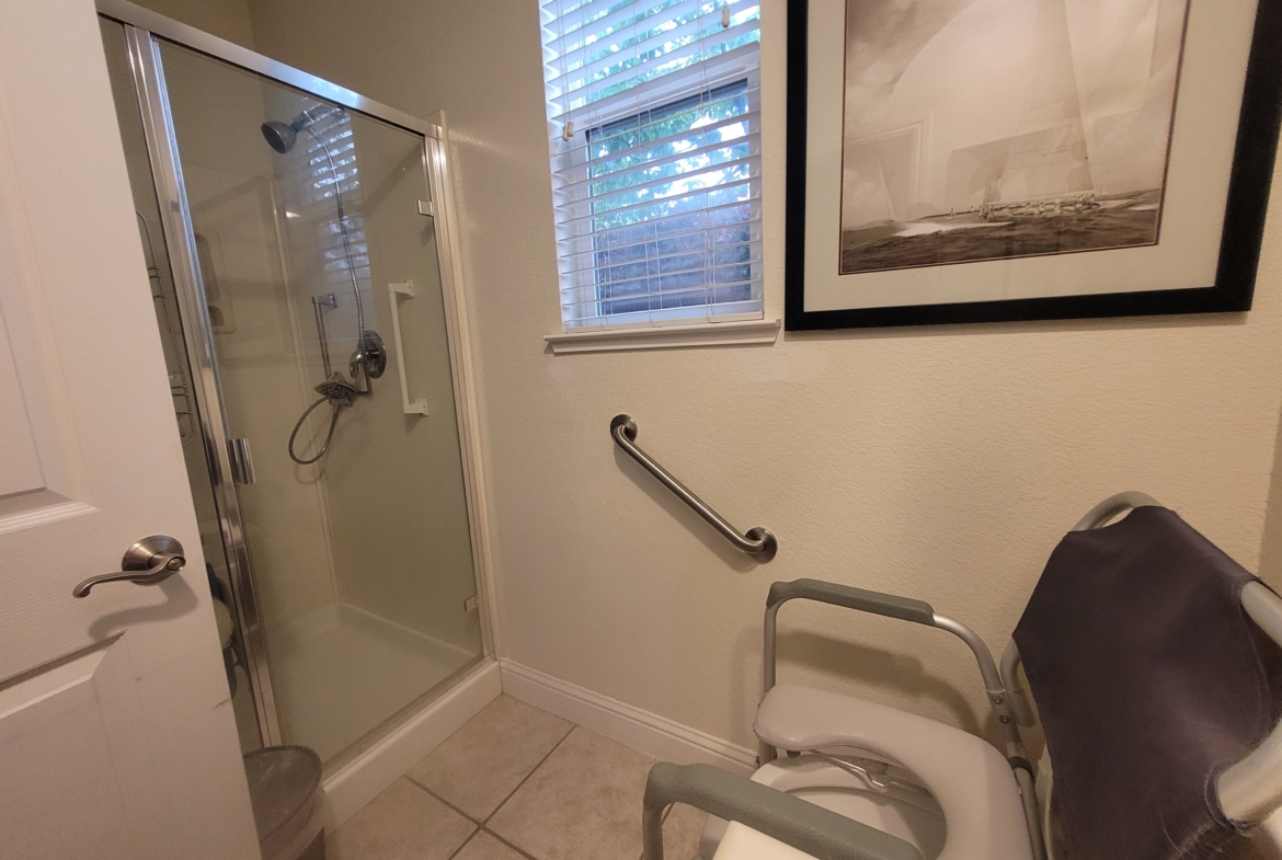 A bathroom with a shower and toilet in it