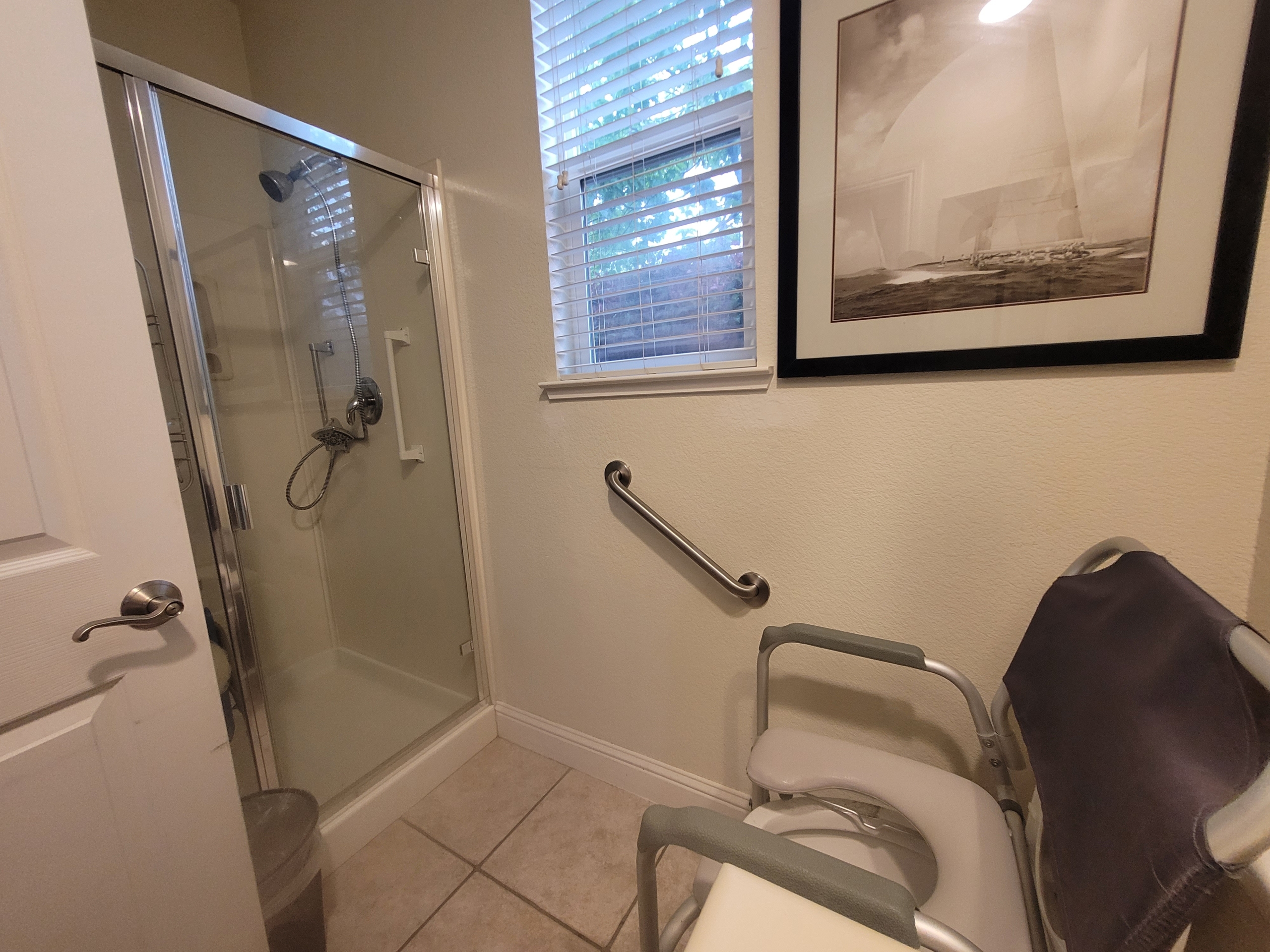 A bathroom with a shower and toilet in it