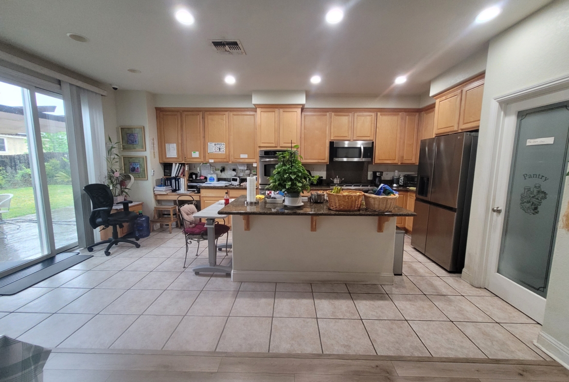 A kitchen with a large island in the middle of it