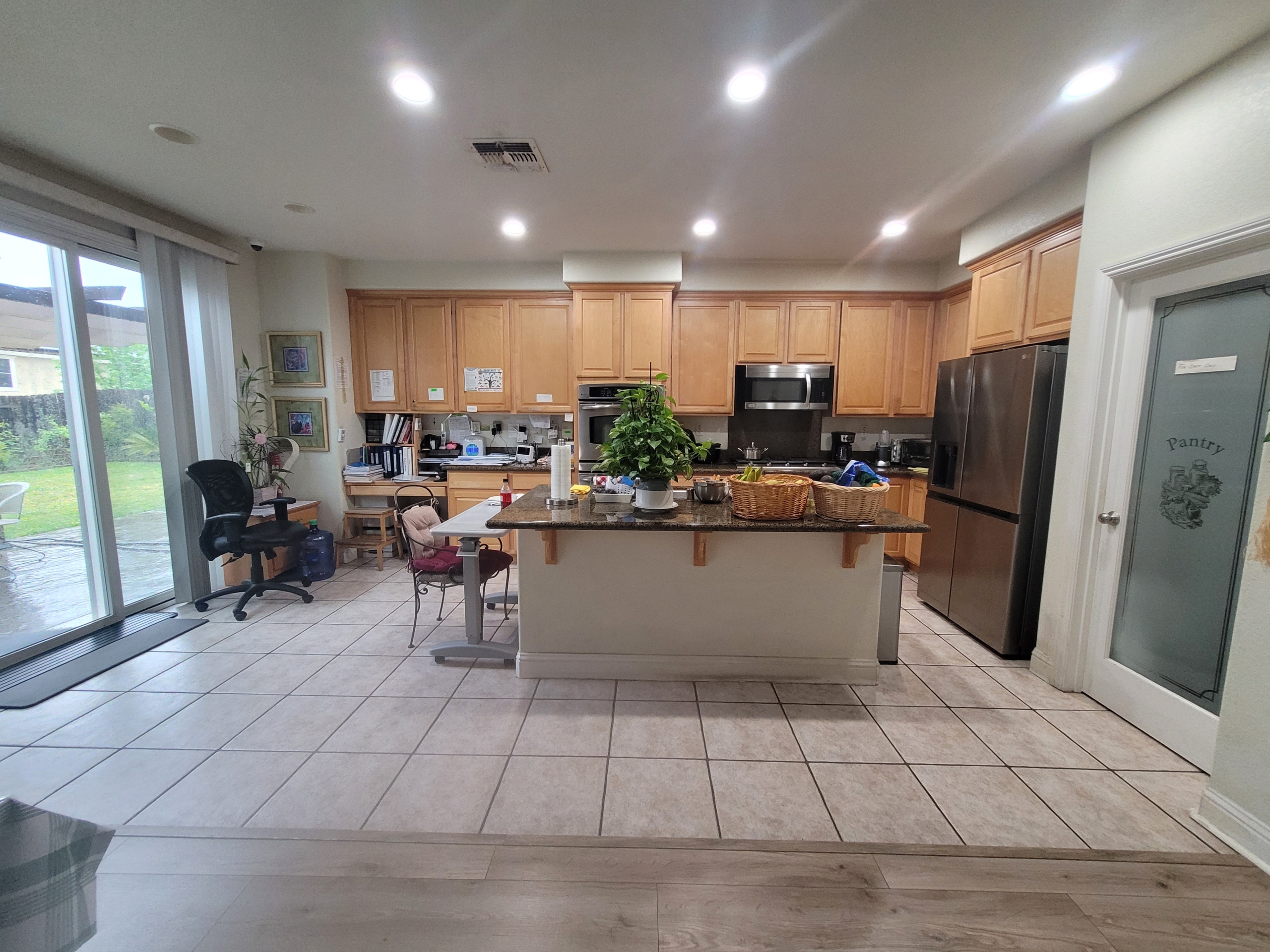 A kitchen with a large island in the middle of it