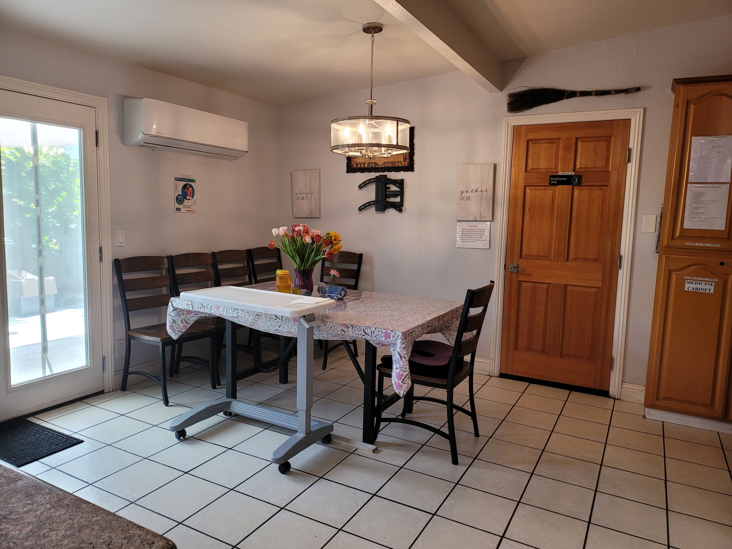 A dining room table with chairs and a door.