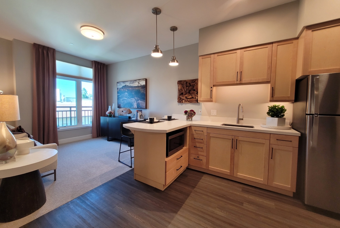 A kitchen with a sink and a microwave