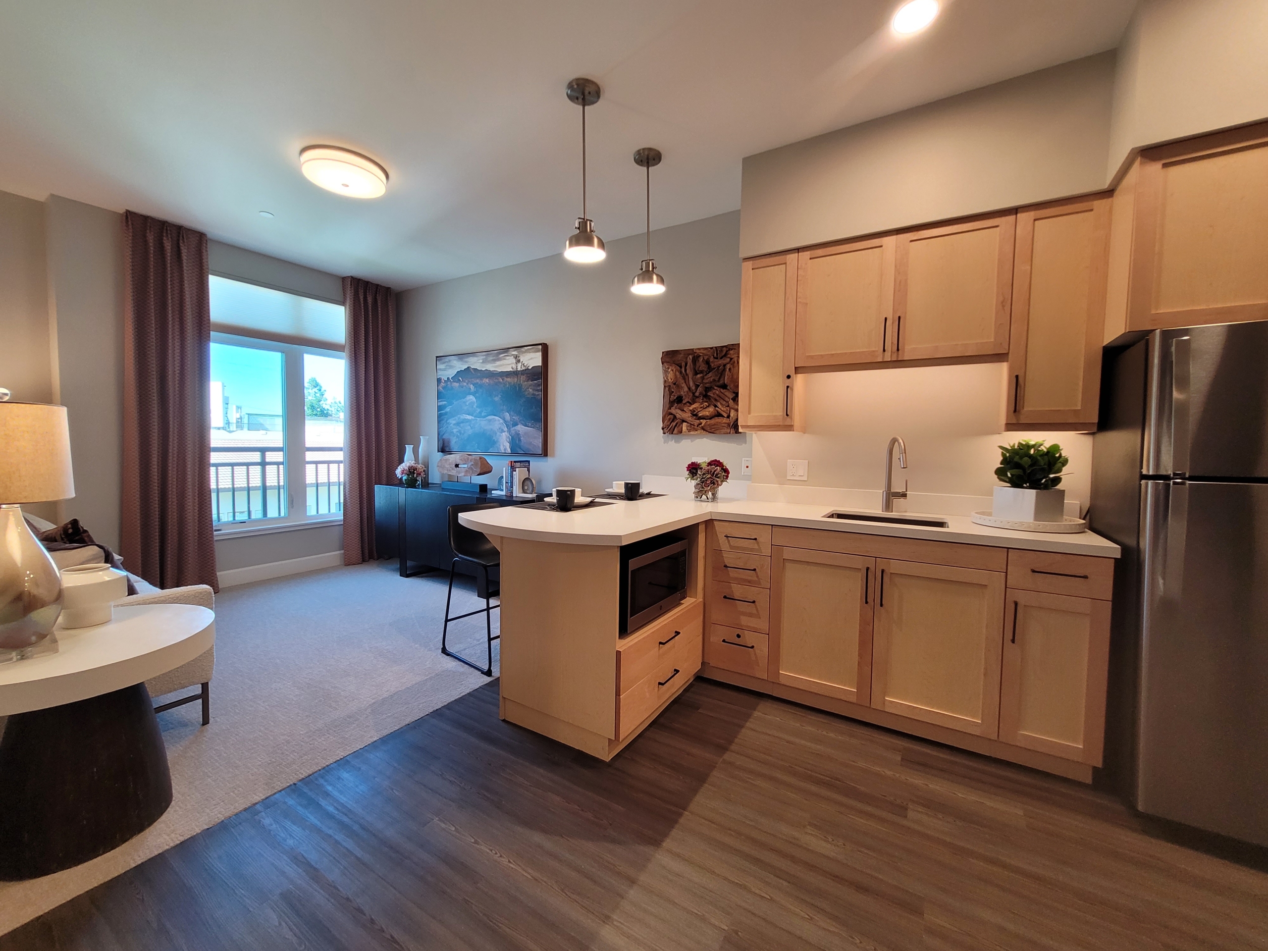 A kitchen with a sink and a microwave