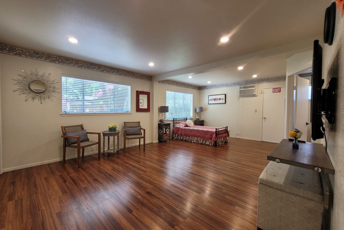 A room with wooden floors and furniture in it.