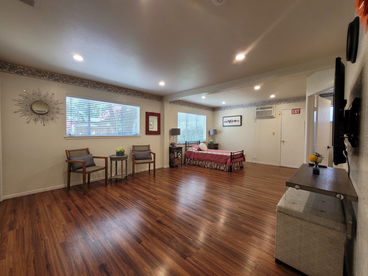 A room with wooden floors and furniture in it.