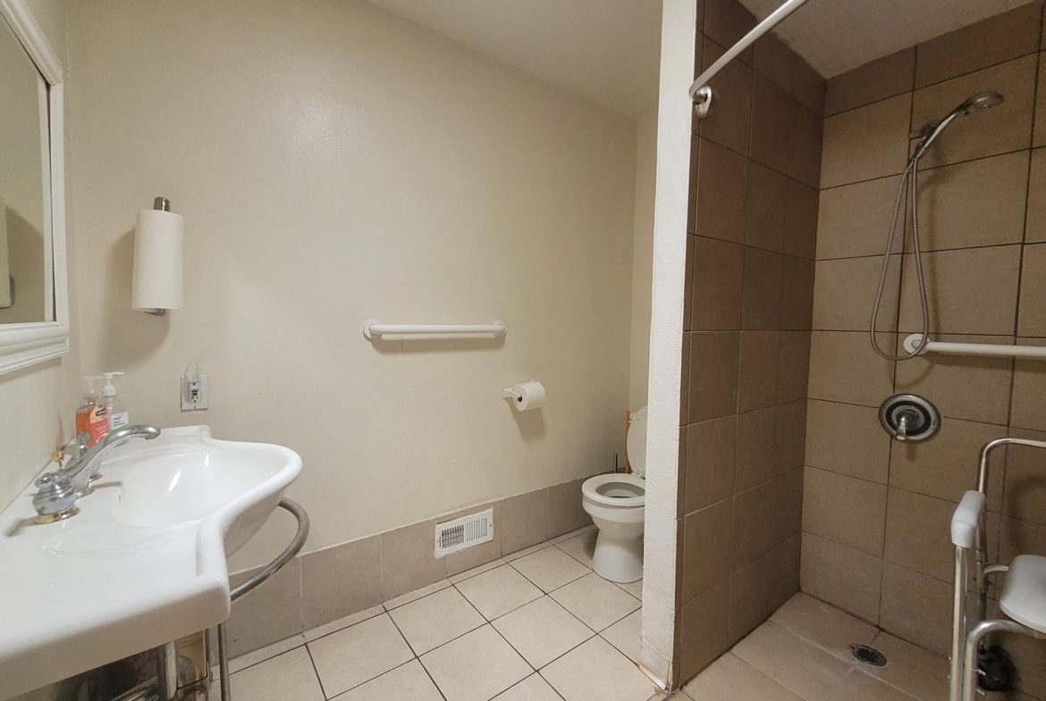 A bathroom with a toilet and sink in it