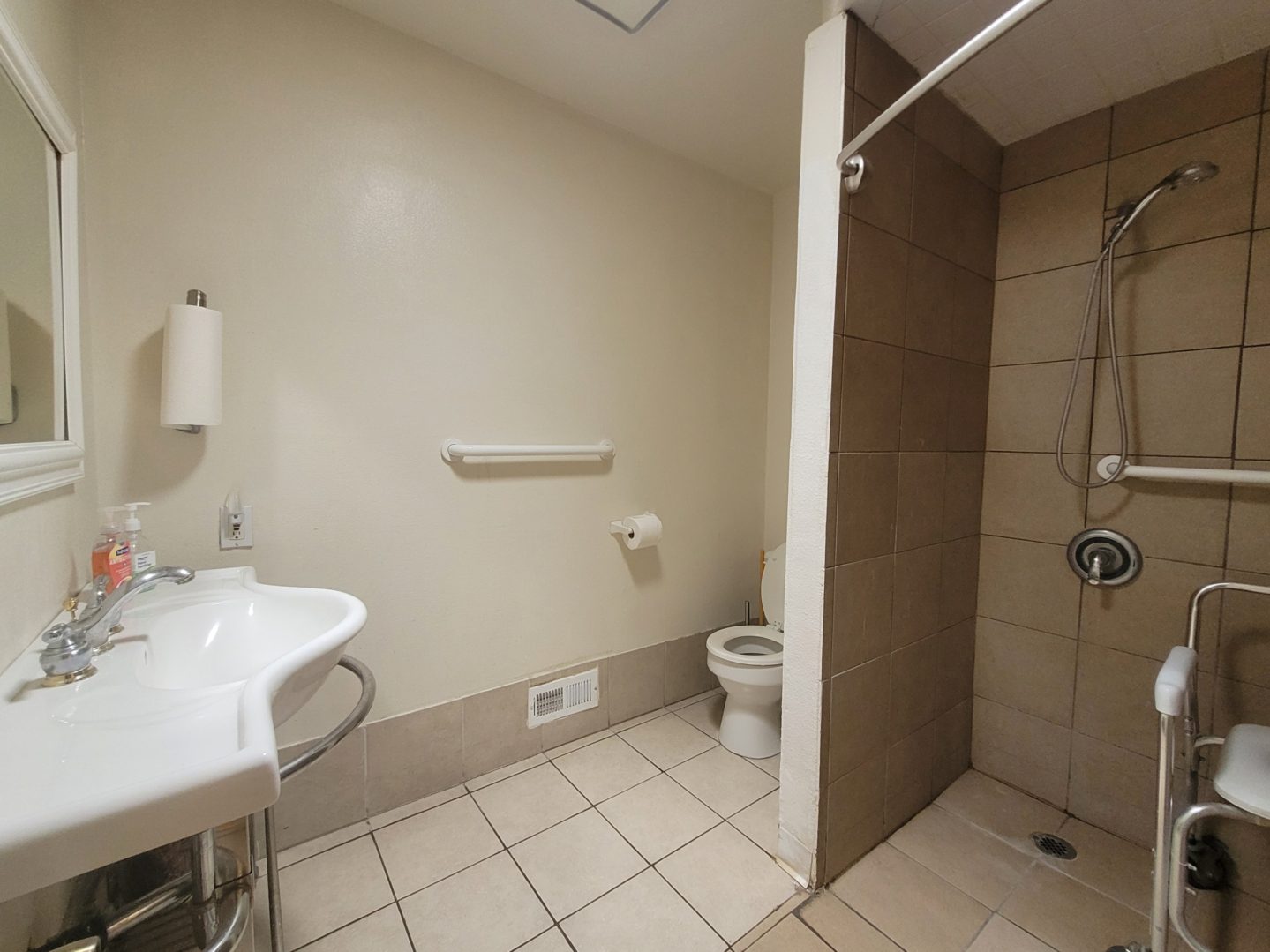 A bathroom with a toilet and sink in it