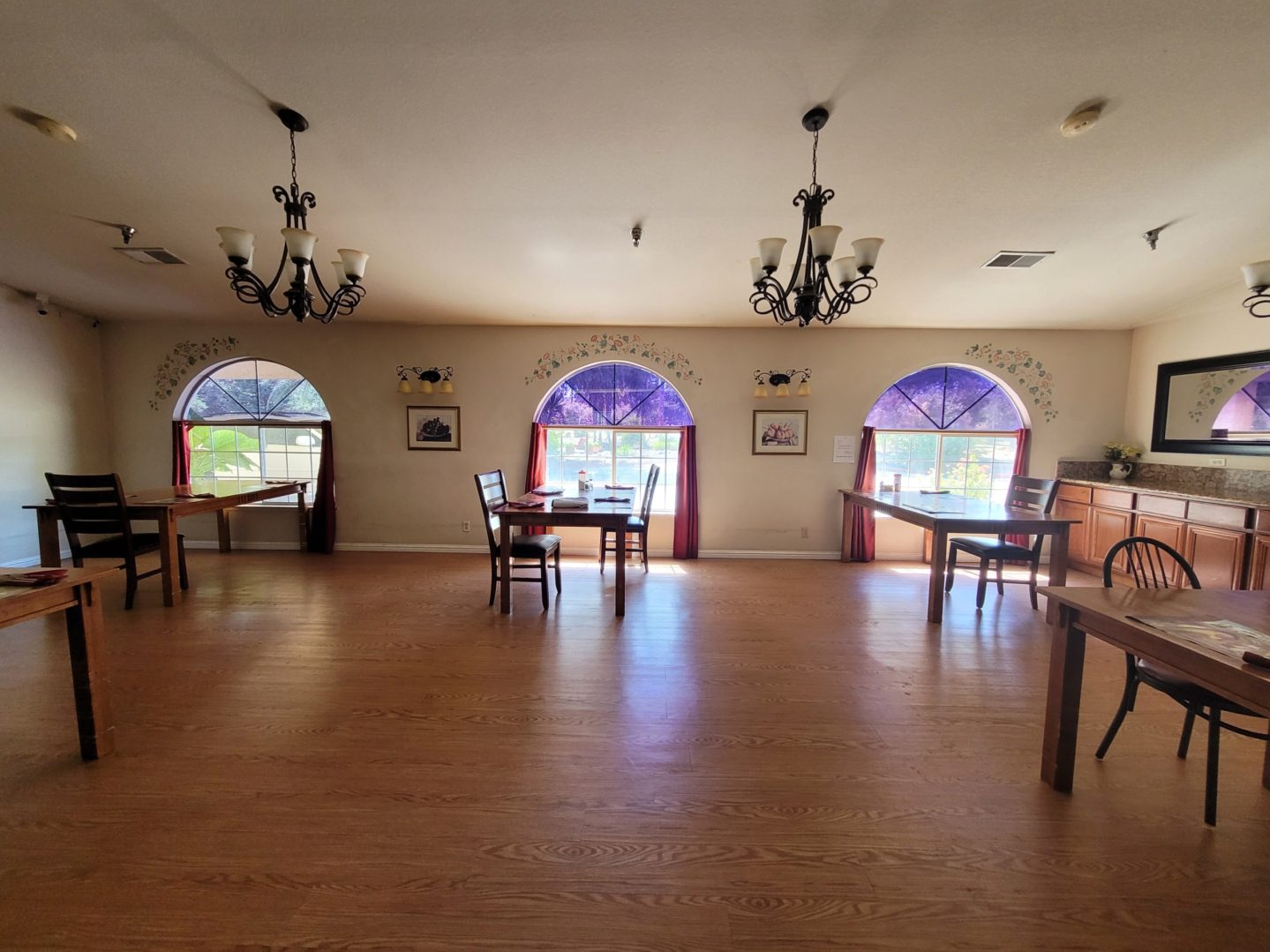 A room with several tables and chairs in it