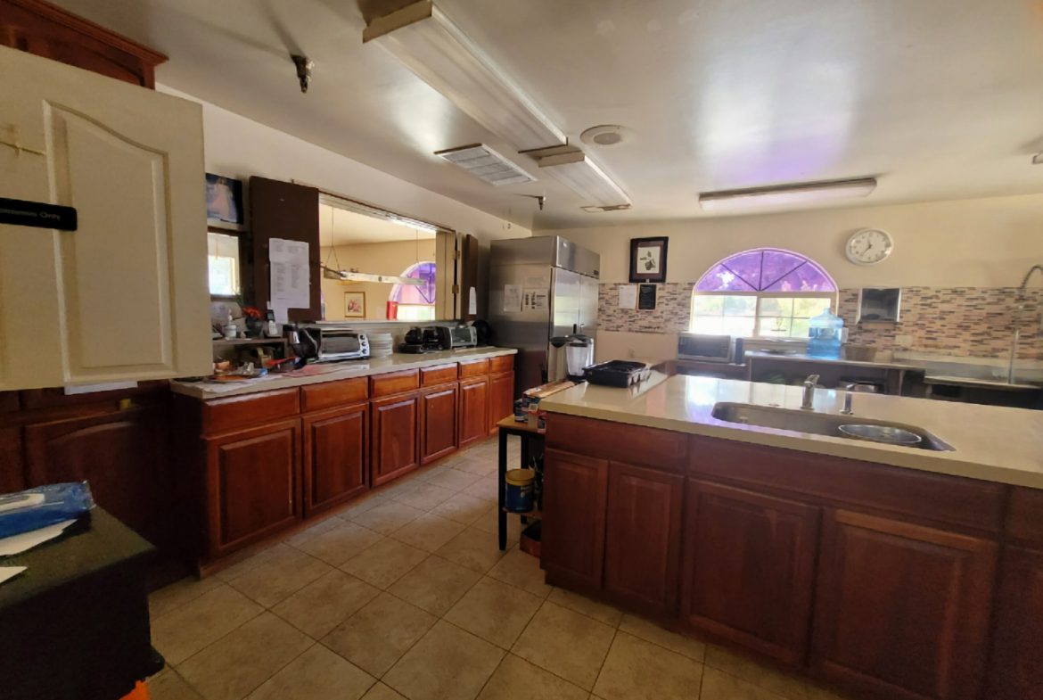 A large kitchen with wooden cabinets and counters.