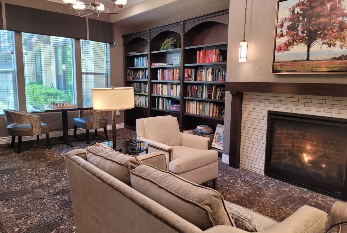 A living room with two couches and a fireplace.