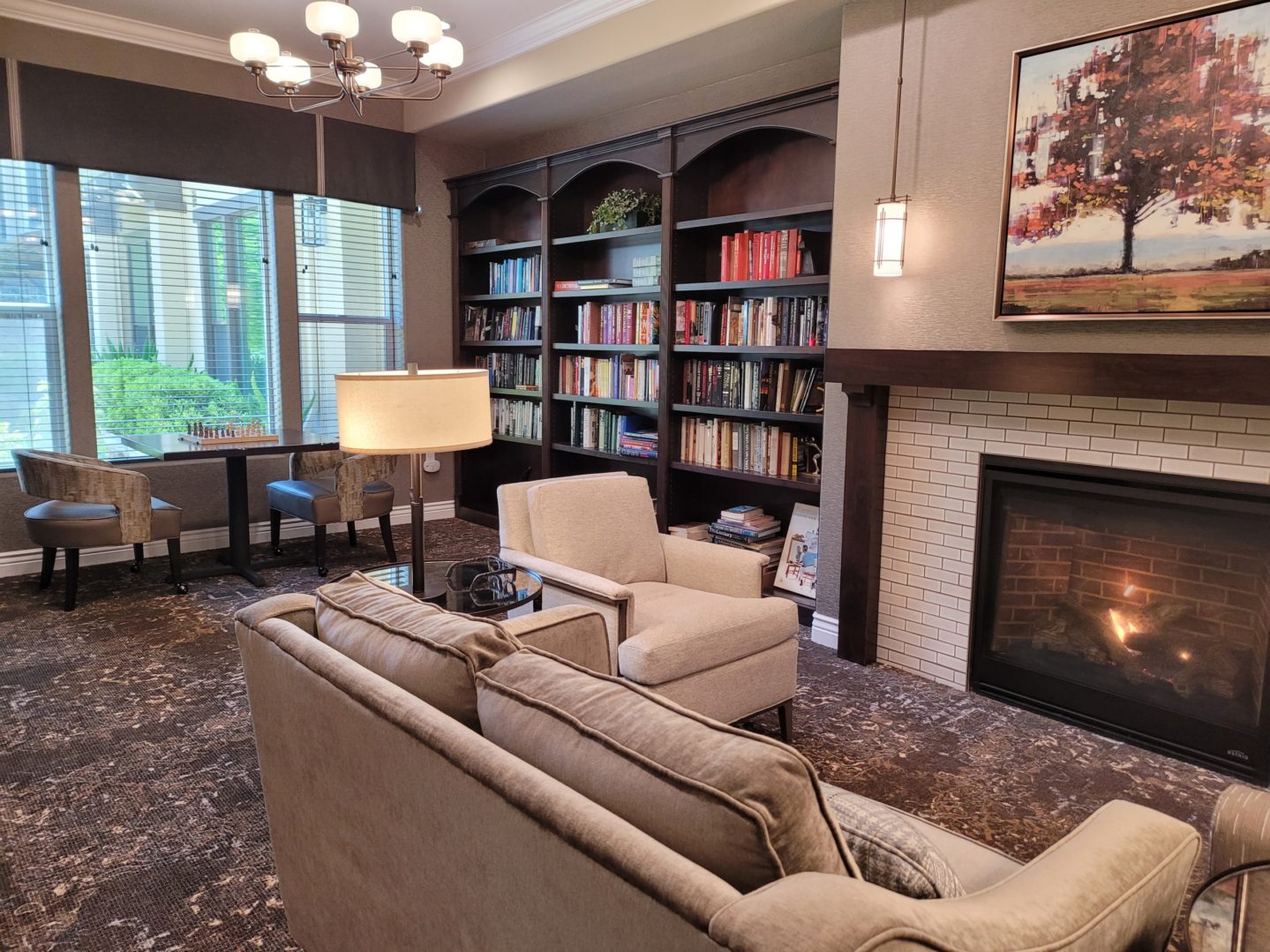 A living room with two couches and a fireplace.