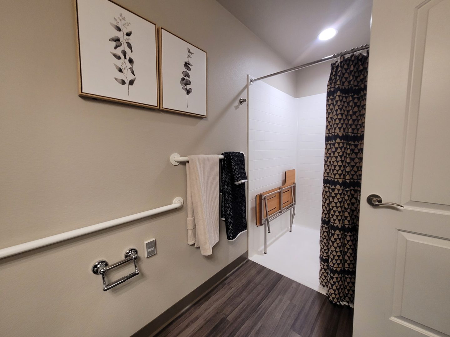 A bathroom with a shower and toilet in it