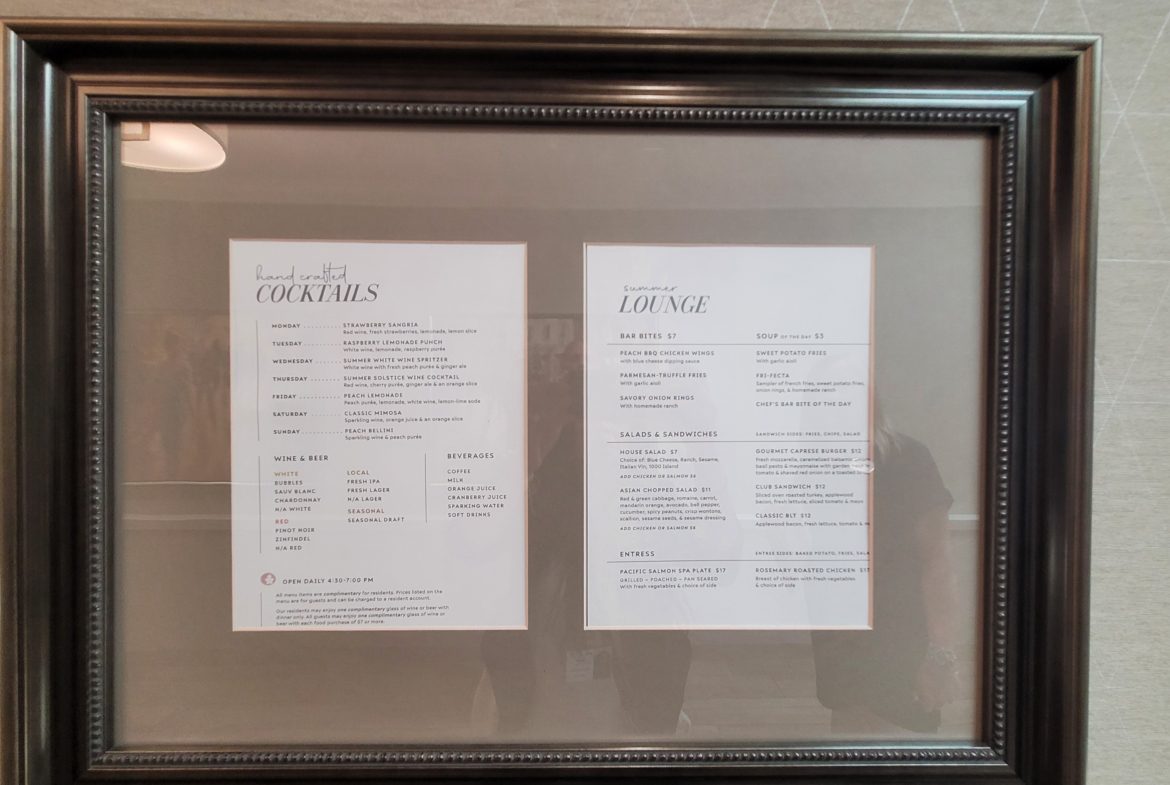 A framed menu of two different types of food.