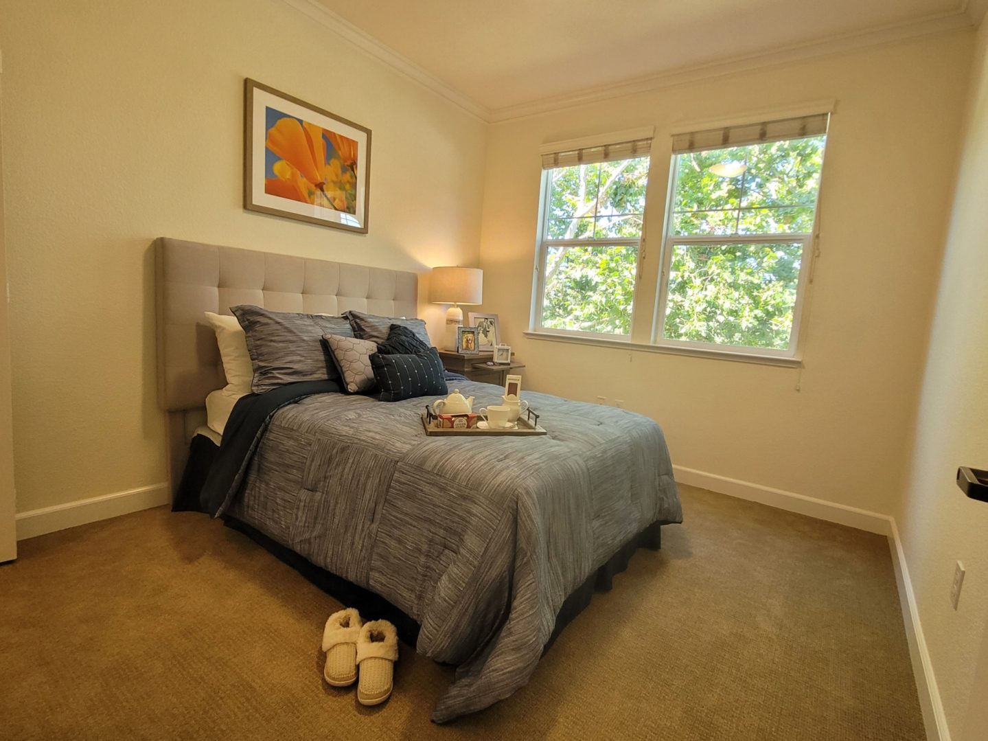 Cozy bedroom with a neatly made bed.
