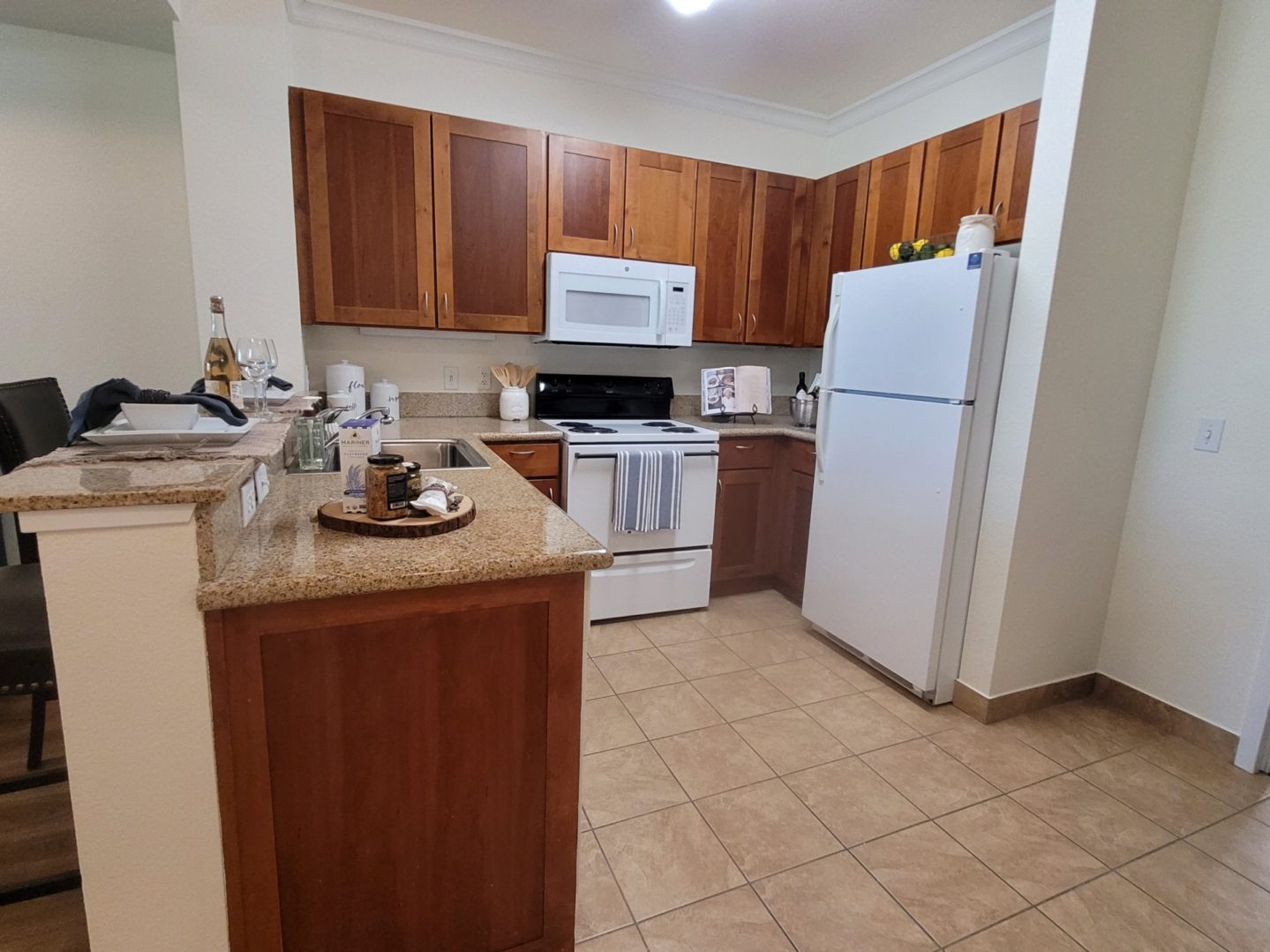 Modern kitchen with wooden cabinets and appliances.