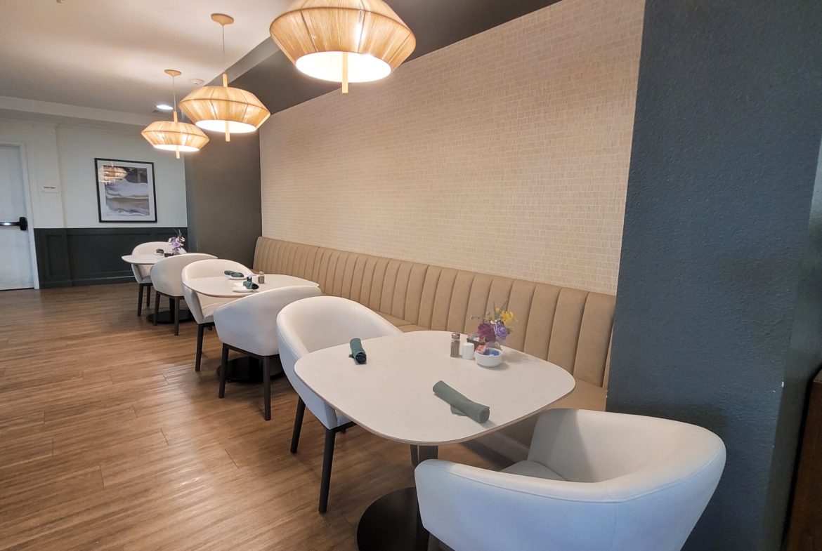 Modern restaurant seating with stylish table settings.