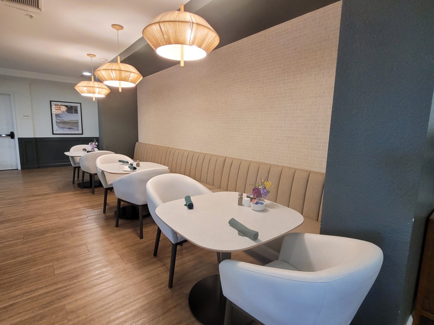 Modern restaurant seating with stylish table settings.