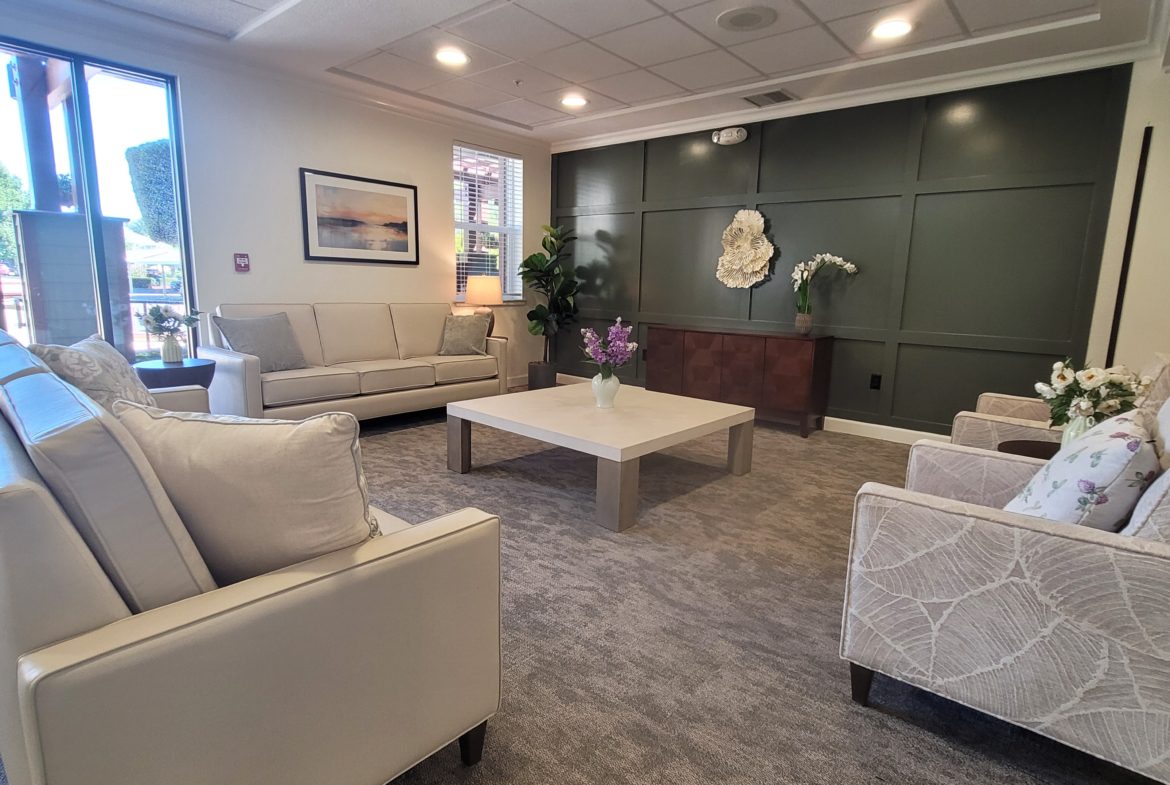 Modern lounge area with sofas and table.