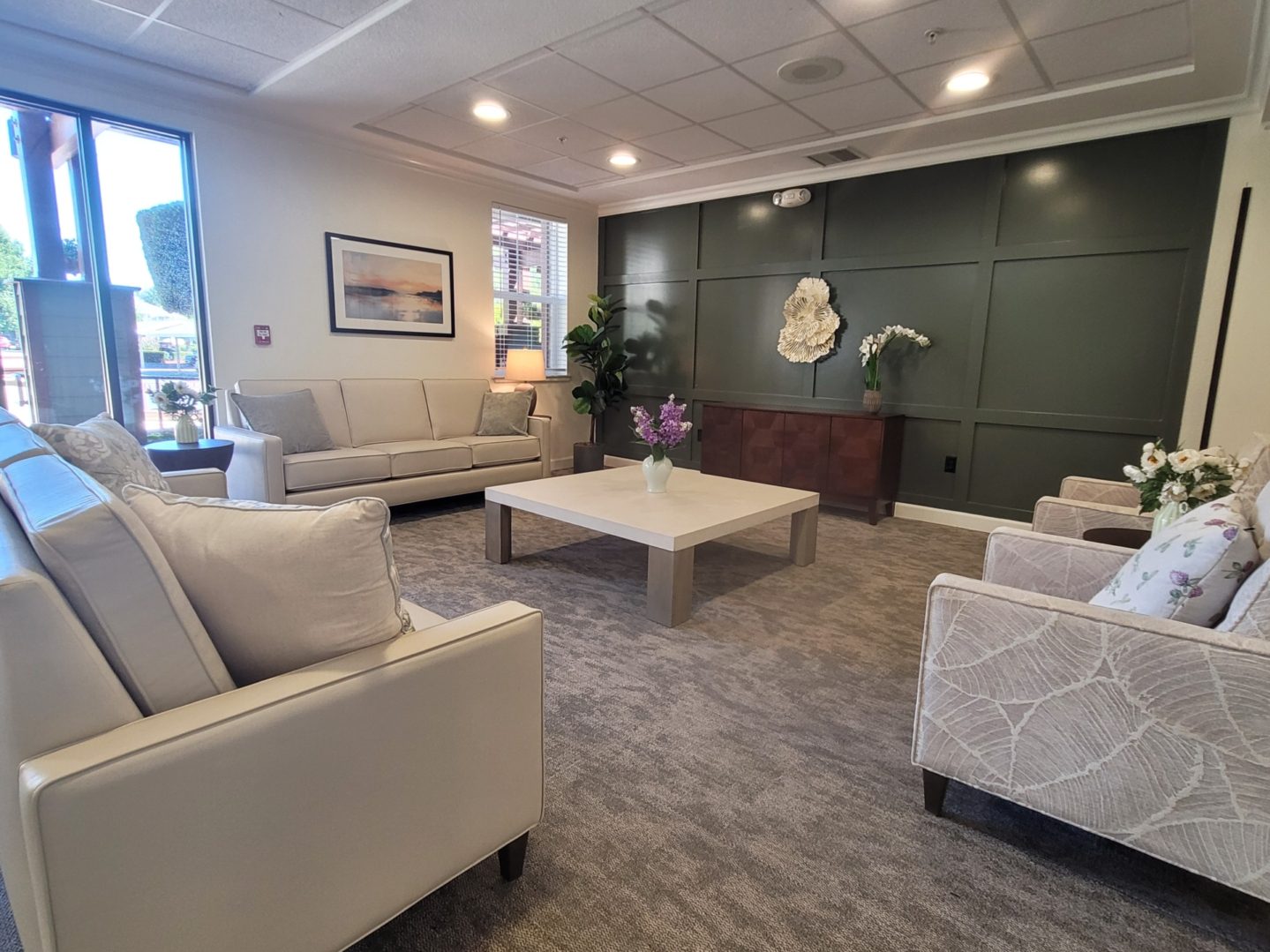 Modern lounge area with sofas and table.