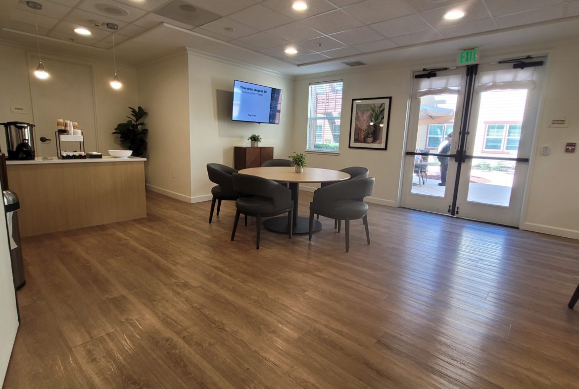 Modern lounge area with wooden flooring.