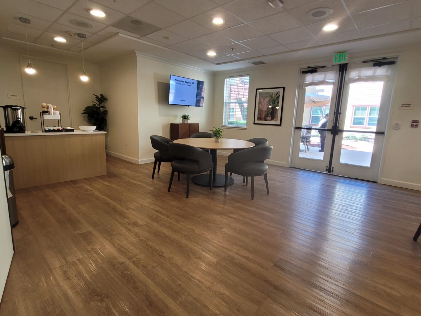 Modern lounge area with wooden flooring.