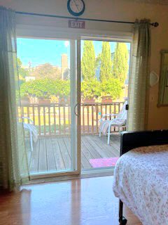 Room with sliding door to garden deck.
