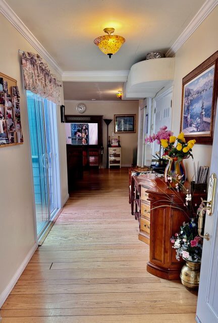 Home hallway with wooden floor and decor.