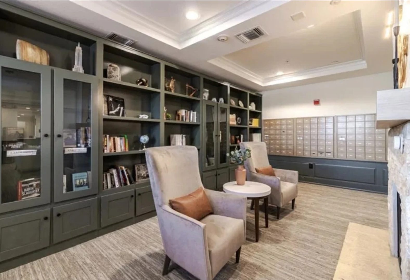Library lounge with chairs and bookshelves.
