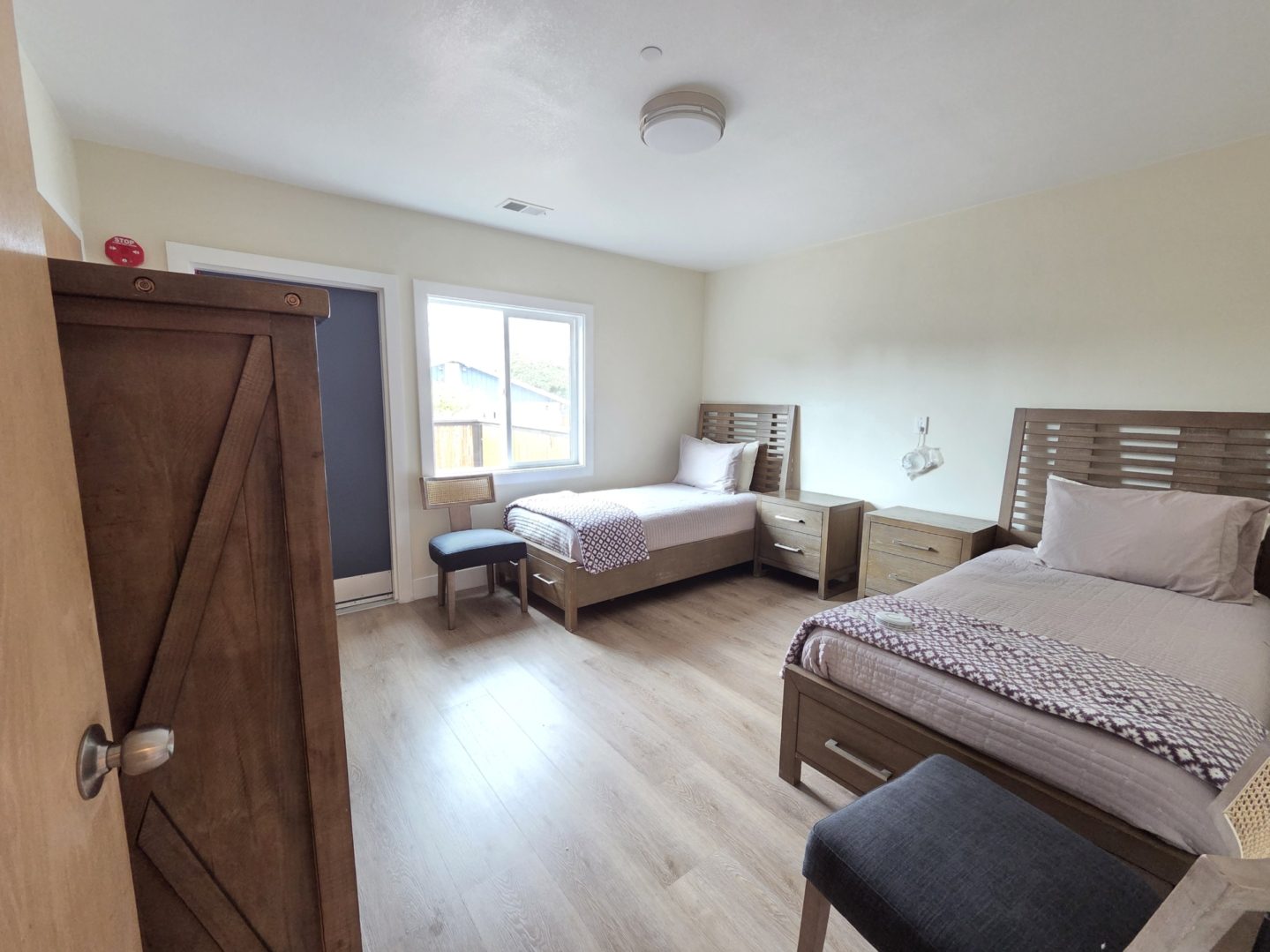 Two beds in a bright room.