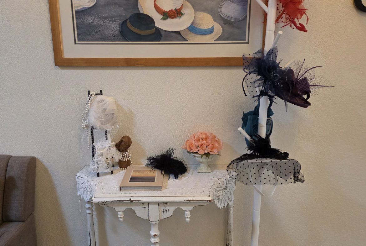 Hats displayed on a table and stand.