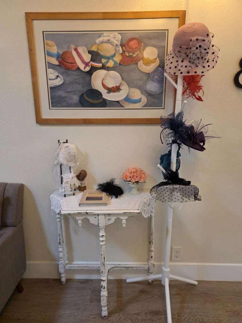 Hats displayed on a table and stand.
