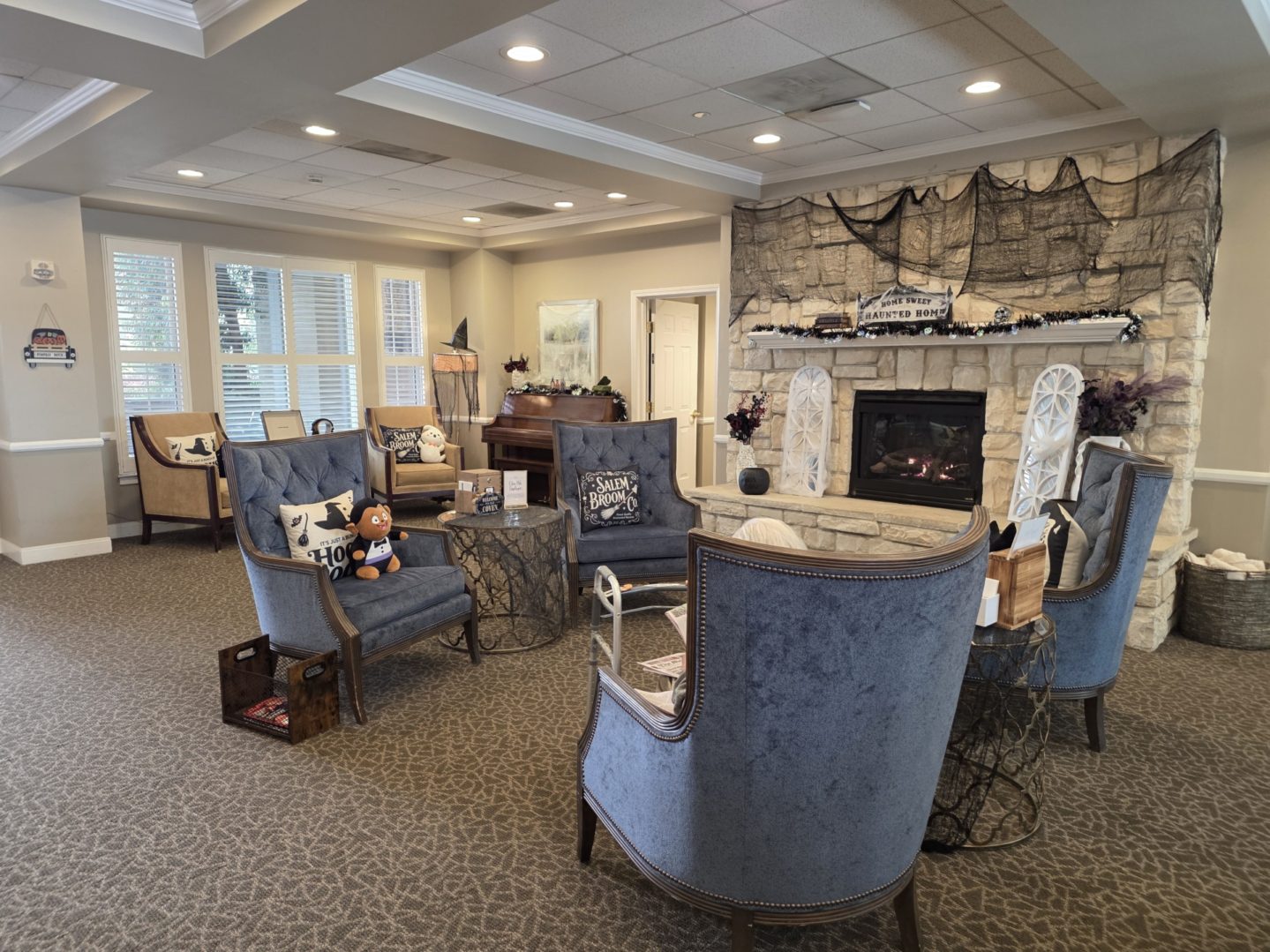 Cozy living room with blue chairs.