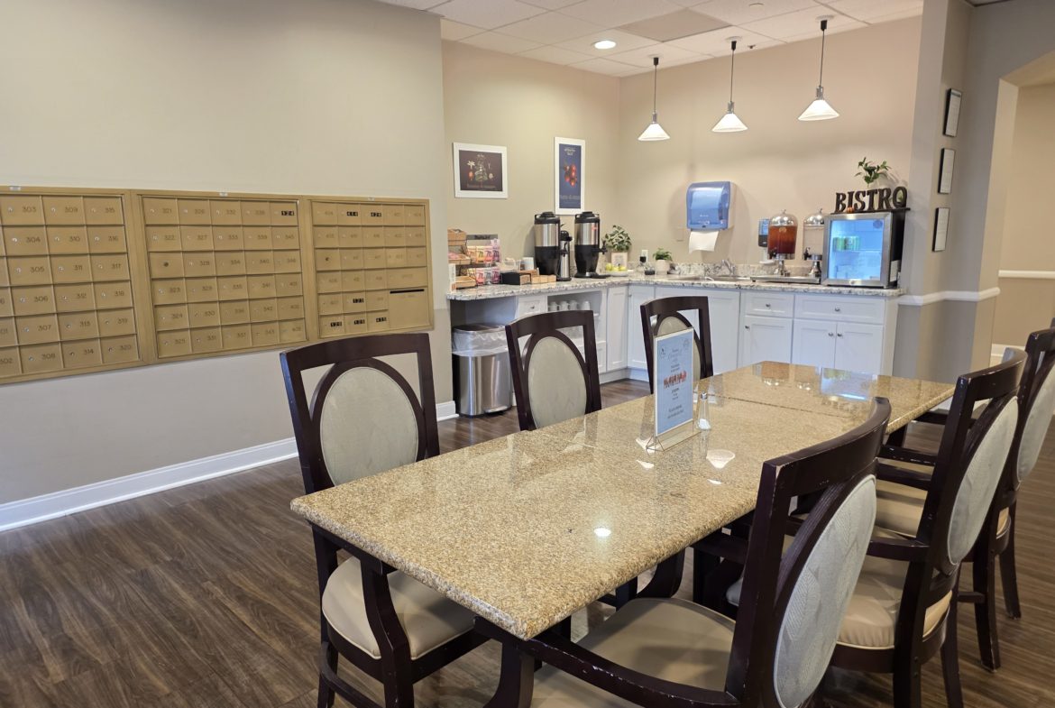 Dining area with mailboxes and refreshment station.