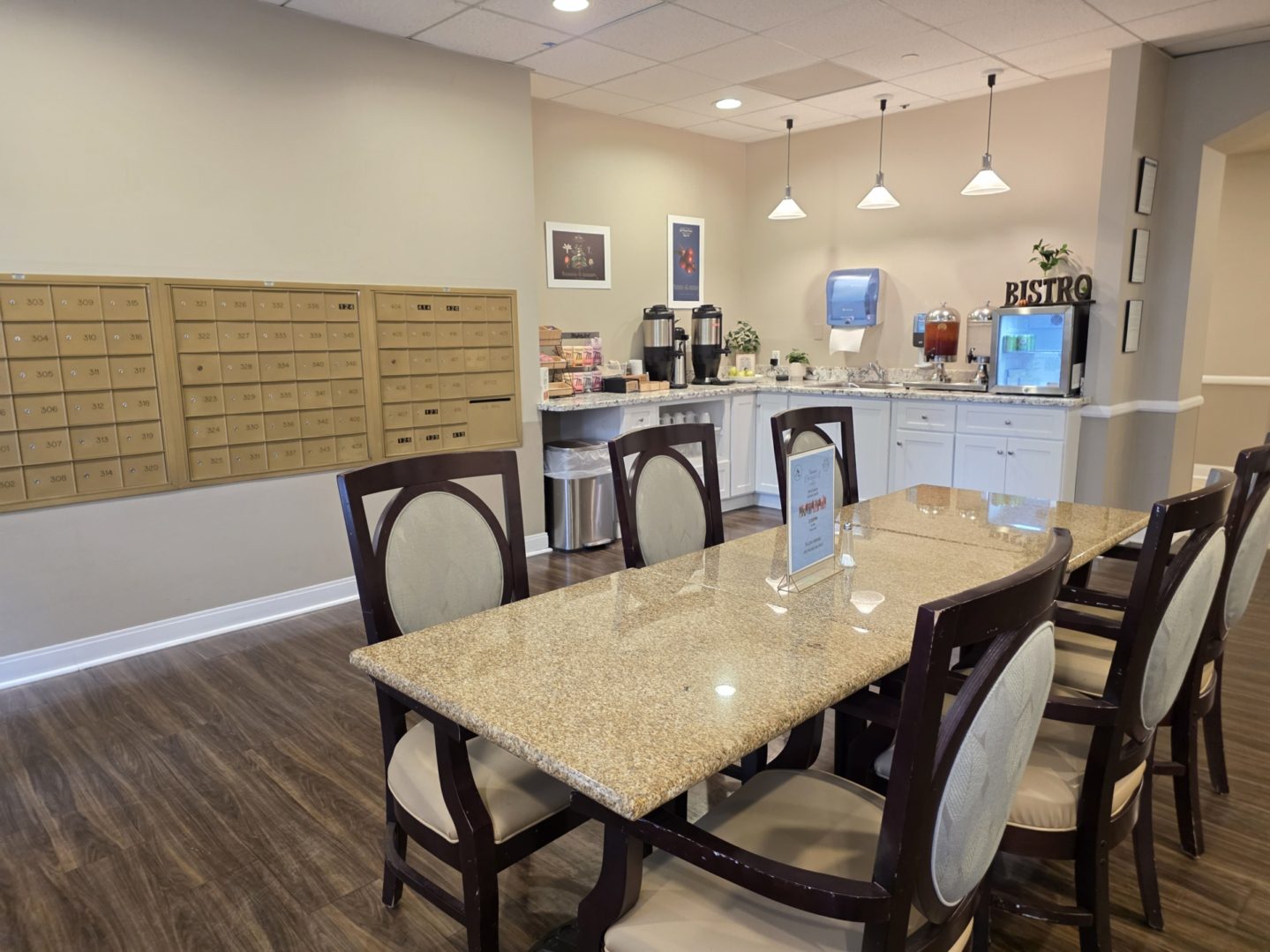 Dining area with mailboxes and refreshment station.