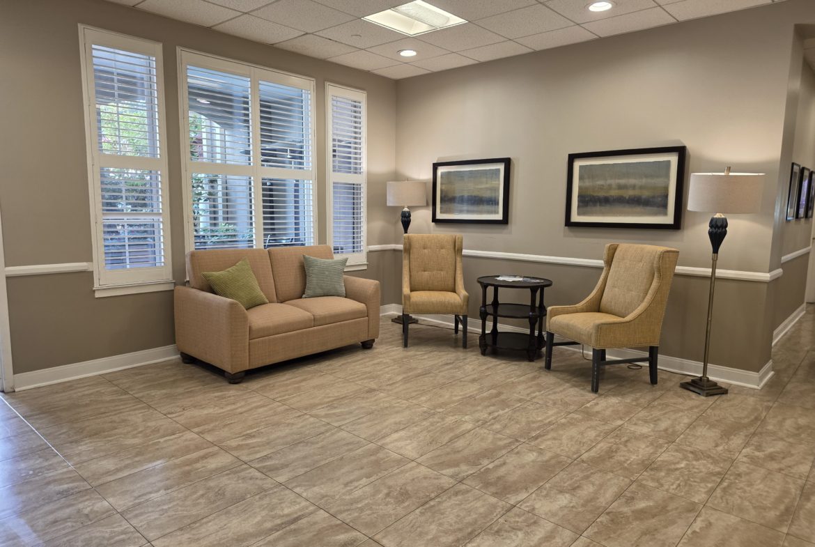 Cozy waiting area with chairs and sofa.