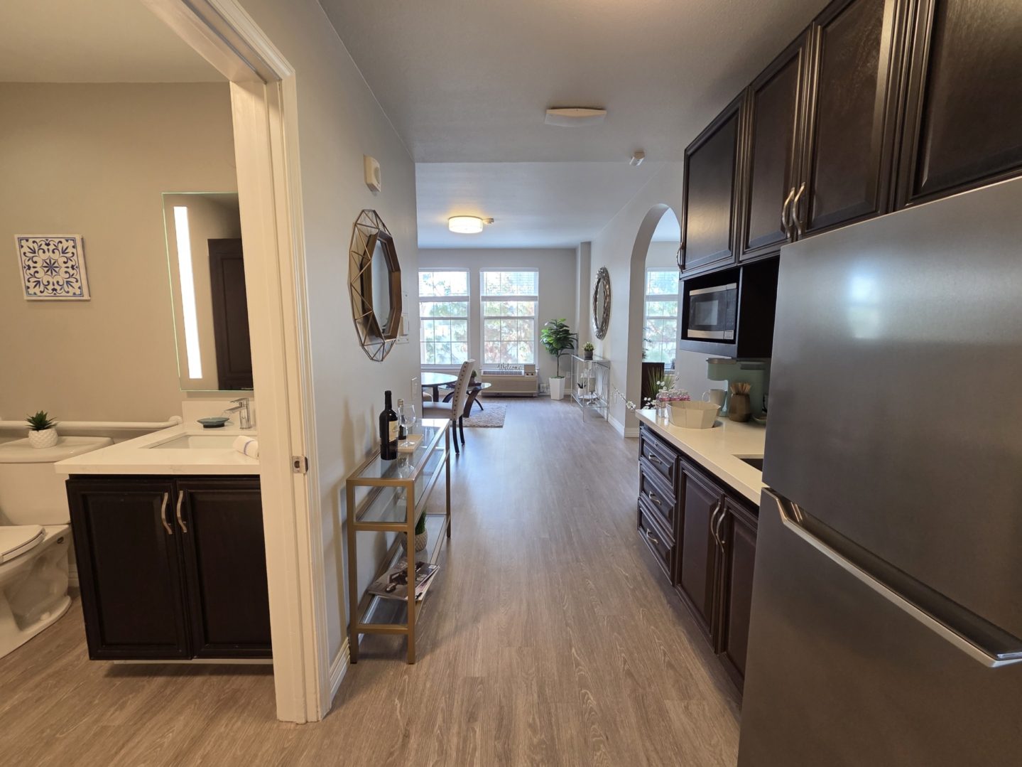 Modern kitchen and living area with decor.