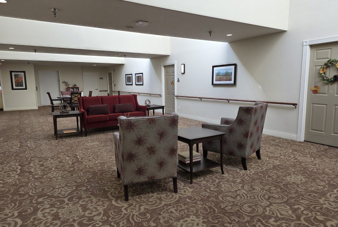 Lobby area with chairs and tables.