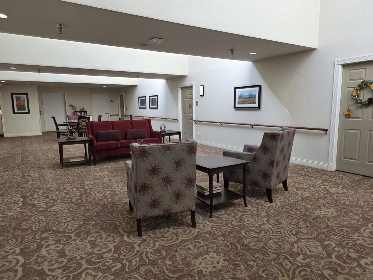 Lobby area with chairs and tables.