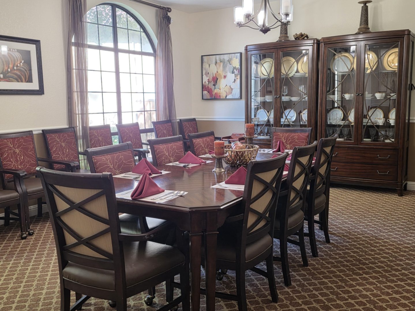 Elegant dining room with large wooden table.