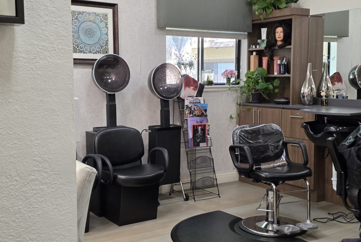 Hair salon interior with styling chairs.